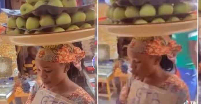 Smart woman: Nigerian apple hawker charges more for transfer as Naira notes become scarce | Battabox.com
