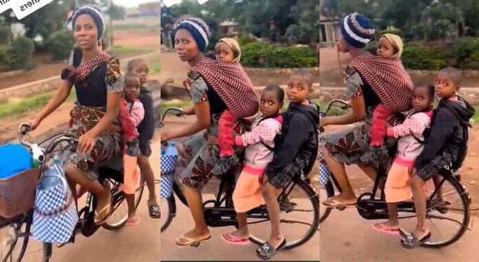 Mum uses bicycle to carry her 3 children, video melts hearts on TikTok |Battabox.com