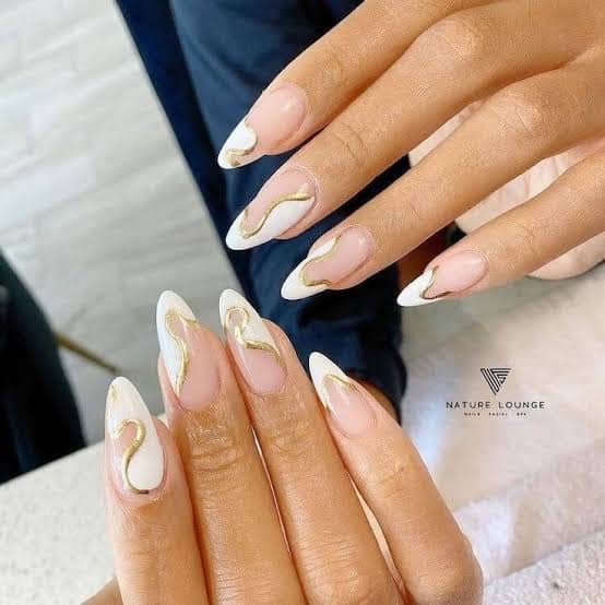 Long sharp white and gold designed nails