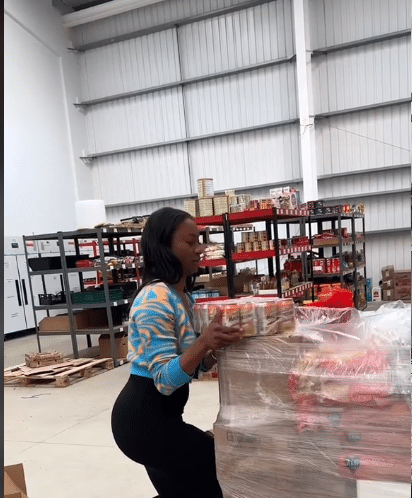 Lady shows her African foodstuff store