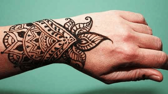 henna inspired hand tattoo