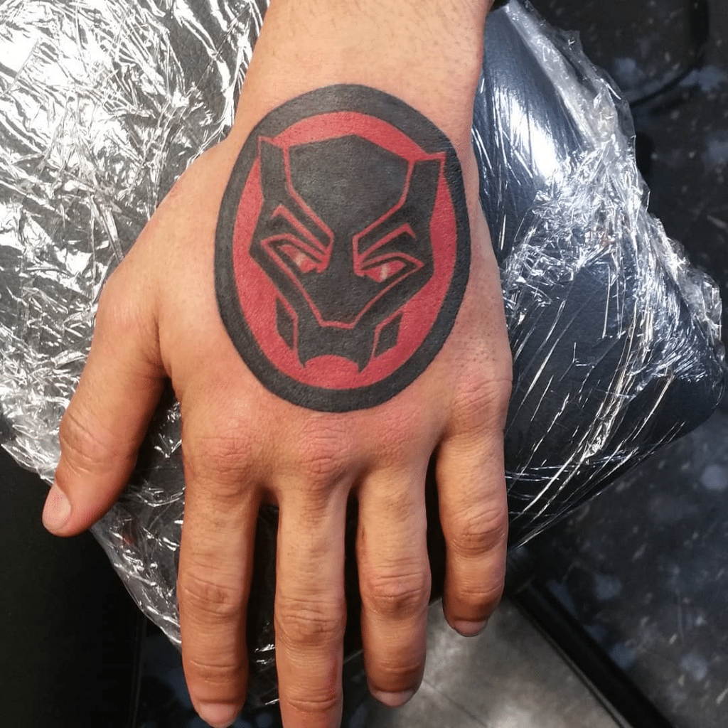 superhero hand tattoo