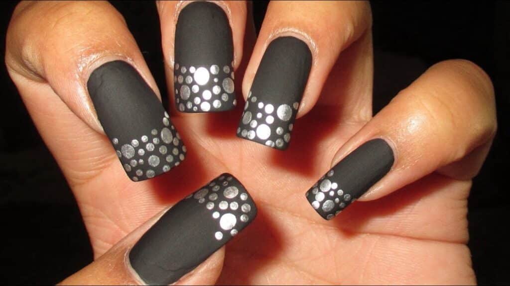 Black French tips with silver polka dots