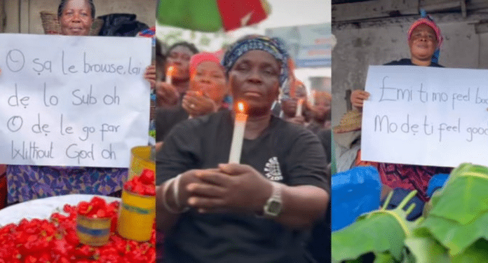 Ghana traders light candles, display placards in honor of Mohbad (VIDEO) | Battabox.com