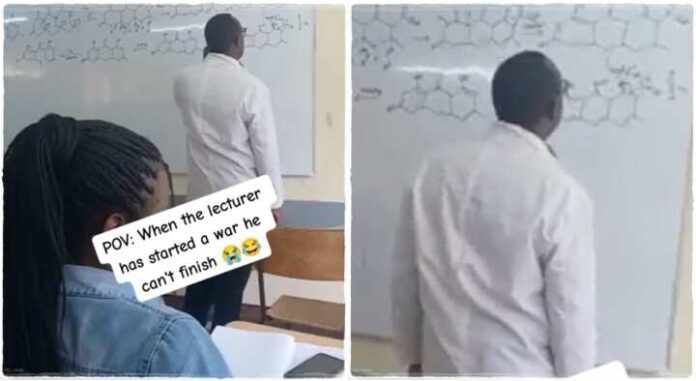 Chemistry lecturer stuck at complicated chemical equation, students laugh