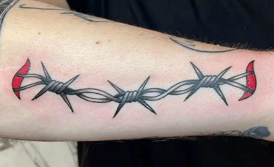 Barbed wire tattoo on arm