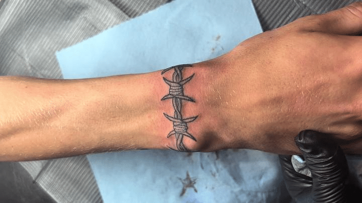 Barbed wire tattoo on wrist