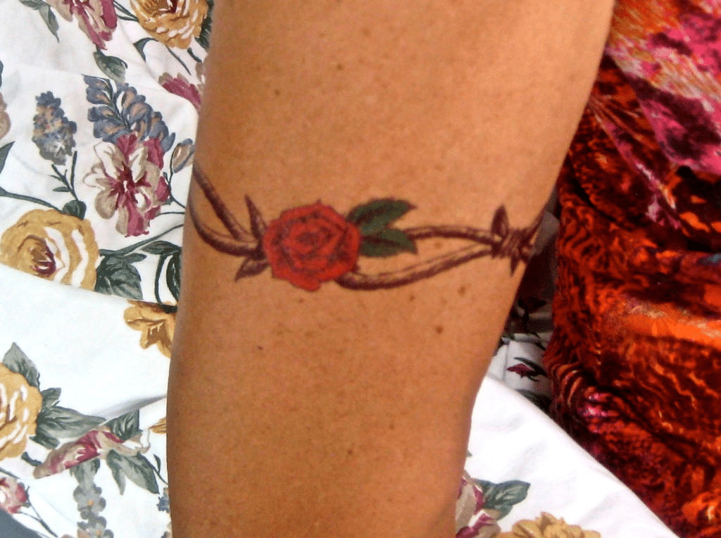 Barbed wire tattoo with a rose