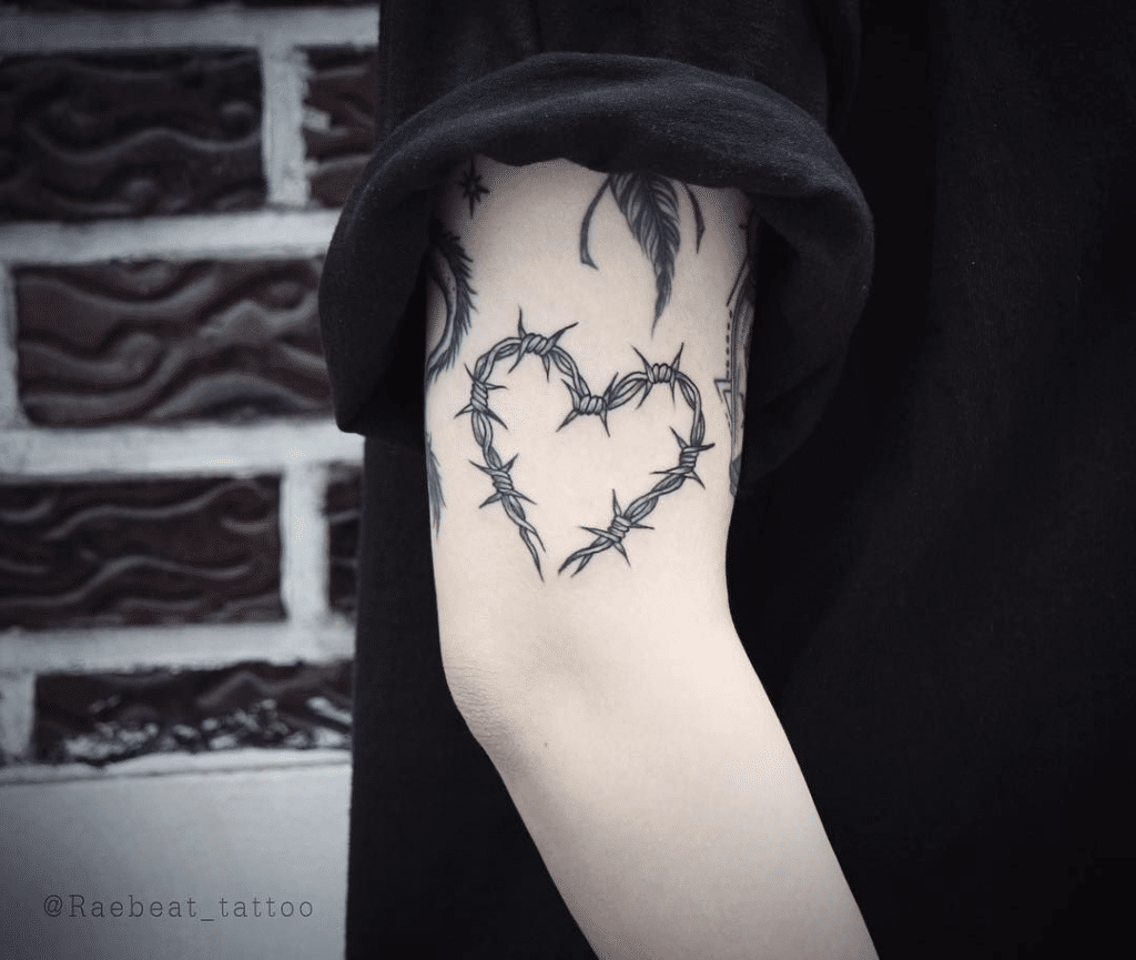 Barbed wire tattoo with heart