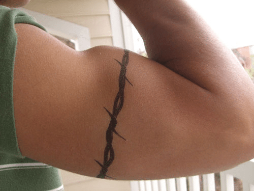 Barbed wire tattoo around the bicep