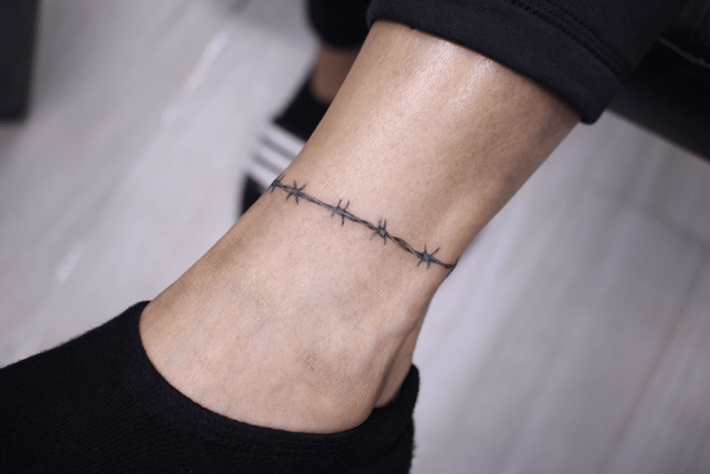 Barbed wire tattoo around the ankle