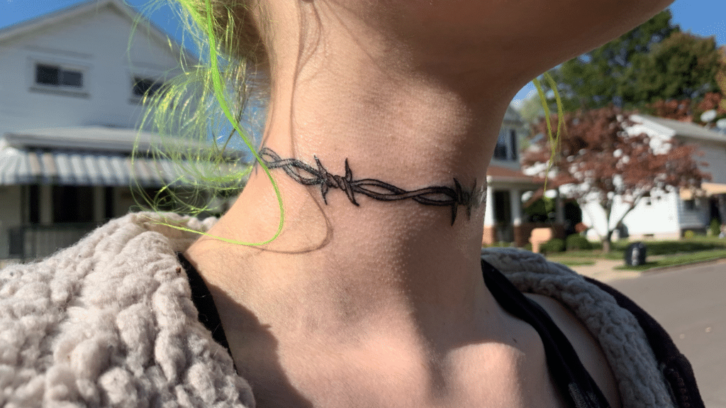 Barbed wire tattoo around the neck