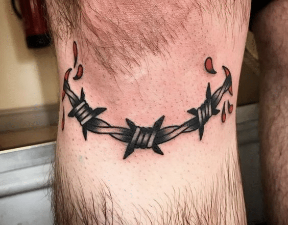 Barbed wire tattoo around the knee