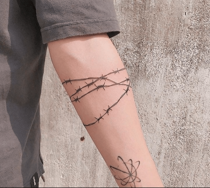 Barbed wire tattoo around the forearm