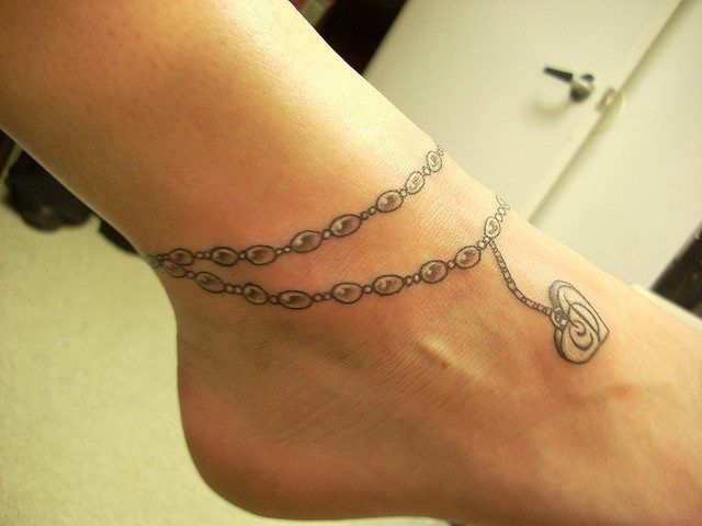 Leg chain tattoo design for women