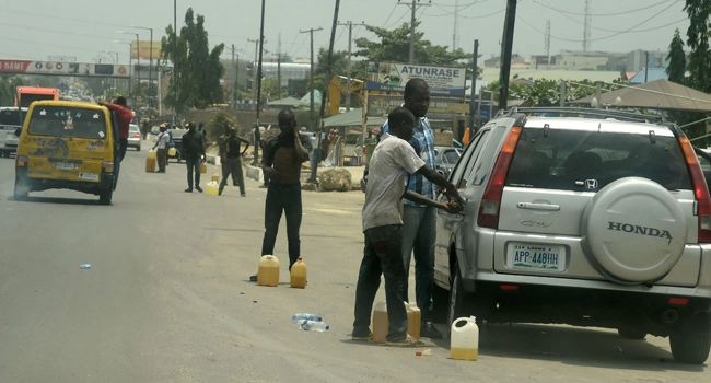black market dealers selling petrol