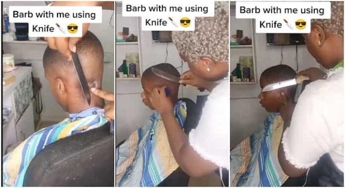 Female barber stands out as she styles hair with kitchen knife