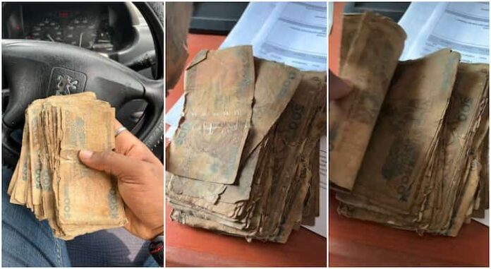Nigerian man shows 'rotting' naira notes he got from bank