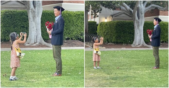 Little girl takes pictures of her father who just graduated with honours from US university