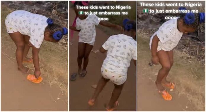 American-based Nigerian children walk funny on sand in the village
