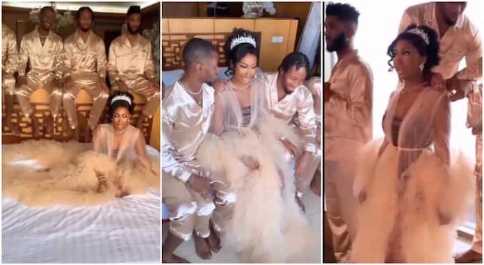 Bride blushes as her four brothers stand in as bridesmaids on her wedding day