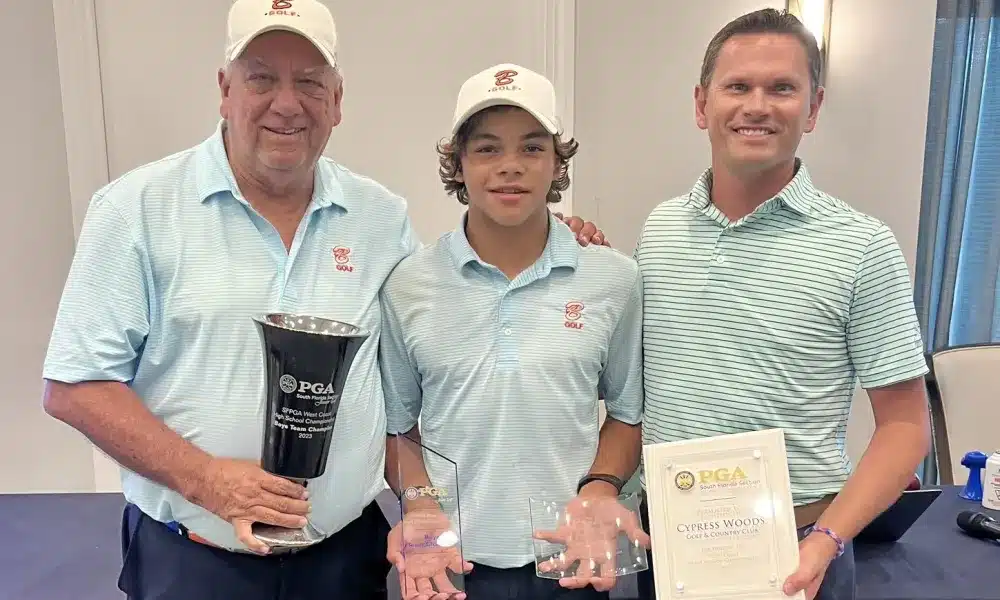 Charlie Axel Woods shows off  trophy haul after shooting a 102 to be the individual champ of the SFPGA's West Coast High School tournament at Cypress Woods Golf and Country Club in Naples on Sept. 30, 2023. 