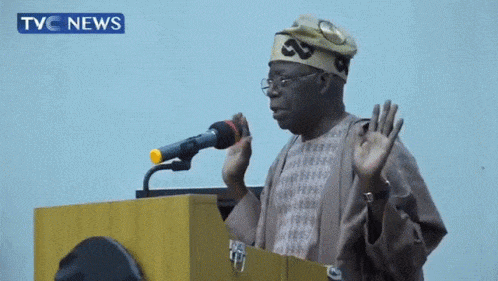 tinubu hands in the air GIF