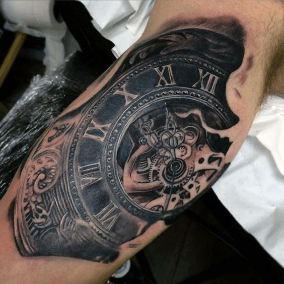 Barbed wire tattoo with a watch